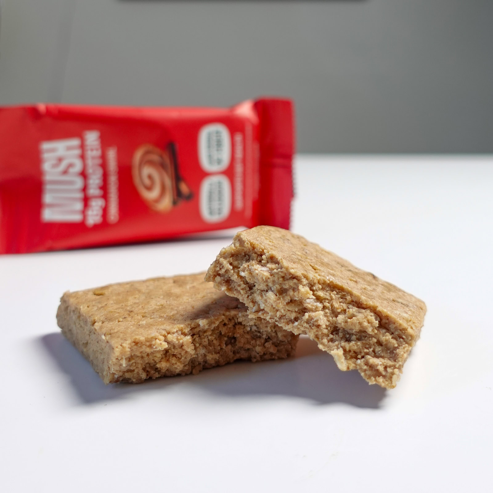 Close-up of a MUSH protein bar with minimal ingredients.