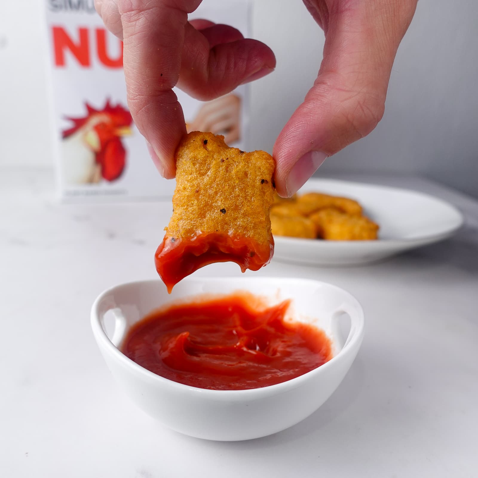 Nuggs dipped in ketchup